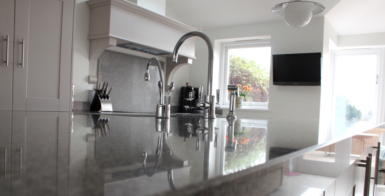 Grey granite worktop and splashback