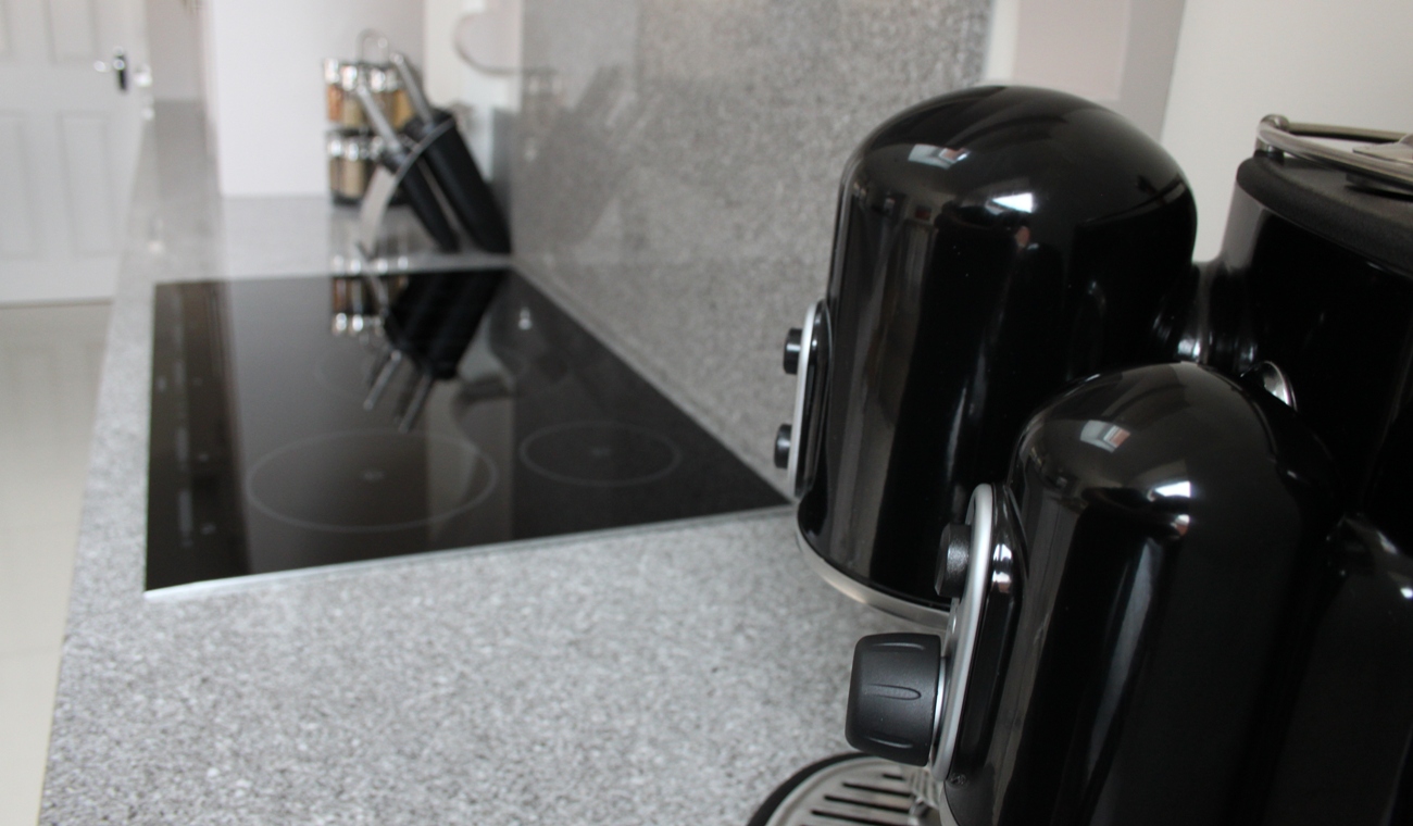 Granite worktop with hob and splash back